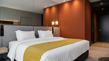 A room comprises of 2 single beds, mini fridge, Coffee/tea maker, 43” LCD TV, walk-in shower, complimentary WIFI, abundant USB ports, phone and contemporary amenities.